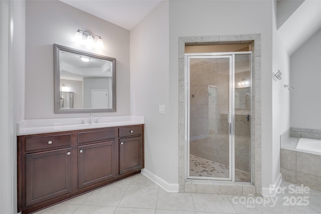 2785 Disney Pl, Indian Land, SC 29707 - bathroom with a garden tub, vanity, a shower stall, tile patterned flooring, and baseboards