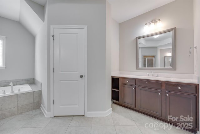 2785 Disney Pl, Indian Land, SC 29707 - bathroom featuring vanity, tile patterned flooring, a garden tub, and baseboards