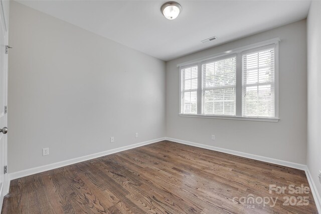 2785 Disney Pl, Indian Land, SC 29707 - empty room with plenty of natural light, baseboards, and dark wood-type flooring