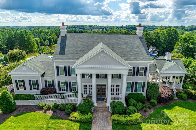 2785 Disney Pl, Indian Land, SC 29707 - view of front of home featuring a chimney, french doors, a porch, and roof with shingles