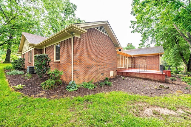 1304 5th Street Cir NW, Hickory, NC 28601 - view of property exterior featuring brick siding, cooling unit, a lawn, and crawl space