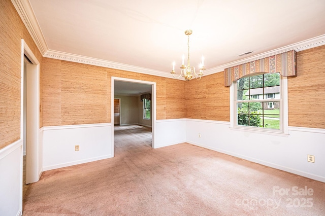 1304 5th Street Cir NW, Hickory, NC 28601 - empty room featuring a chandelier, healthy amount of natural light, a wainscoted wall, ornamental molding, and carpet flooring