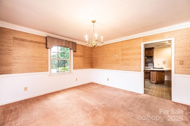 1304 5th Street Cir NW, Hickory, NC 28601 - carpeted empty room featuring a chandelier, a wainscoted wall, ornamental molding, and baseboards
