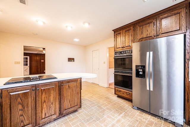 1304 5th Street Cir NW, Hickory, NC 28601 - kitchen with black appliances, brick patterned flooring, ceiling fan, light countertops, and baseboards