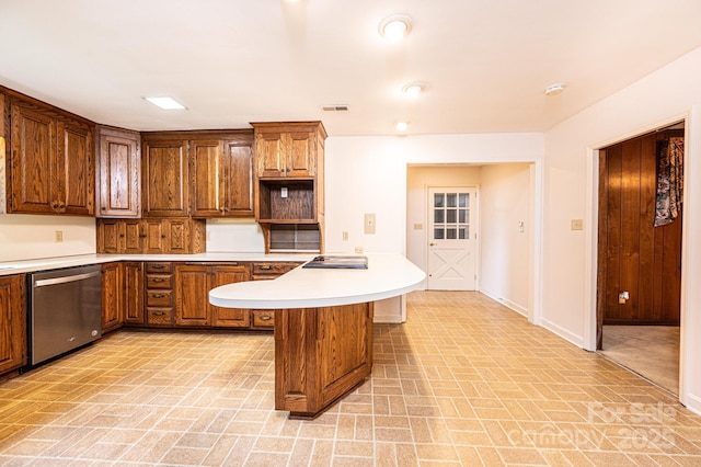 1304 5th Street Cir NW, Hickory, NC 28601 - kitchen with dishwasher, brick patterned flooring, baseboards, light countertops, and a breakfast bar