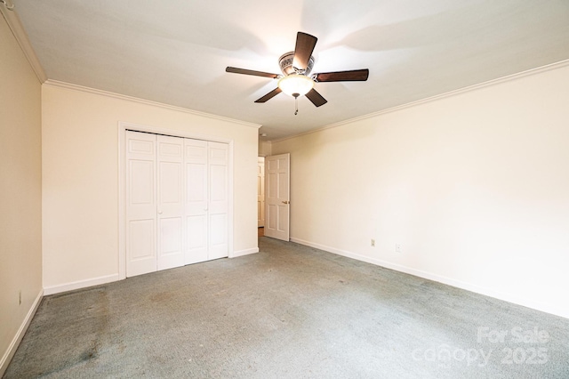 1304 5th Street Cir NW, Hickory, NC 28601 - unfurnished bedroom with carpet, ornamental molding, a closet, baseboards, and a ceiling fan