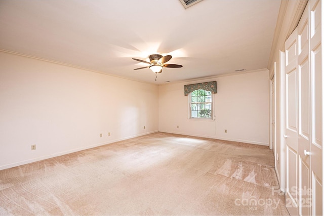 1304 5th Street Cir NW, Hickory, NC 28601 - empty room featuring a ceiling fan, light carpet, baseboards, and crown molding