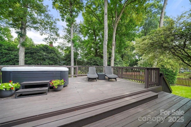 21621 Crown Lake Dr, Cornelius, NC 28031 - wooden terrace featuring a hot tub and view of wooded area