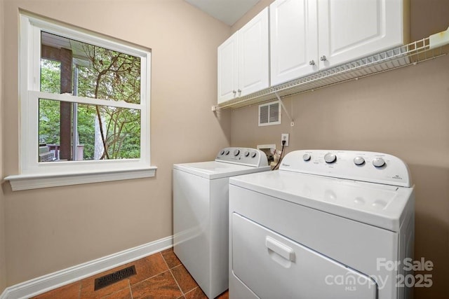 21621 Crown Lake Dr, Cornelius, NC 28031 - laundry area featuring cabinet space, independent washer and dryer, and healthy amount of natural light