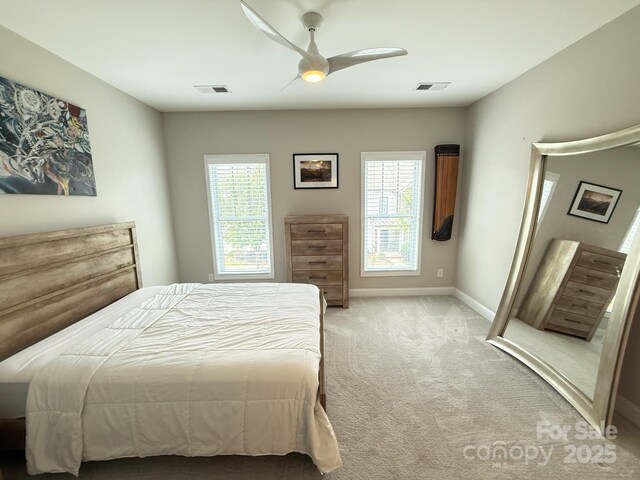 114 Mint Ave Unit A, Mooresville, NC 28117 - bedroom with multiple windows, light colored carpet, and a ceiling fan
