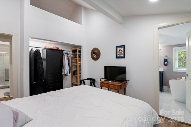 111 Altamahaw Ave, Black Mountain, NC 28711 - bedroom with a walk in closet, ensuite bathroom, a closet, and vaulted ceiling