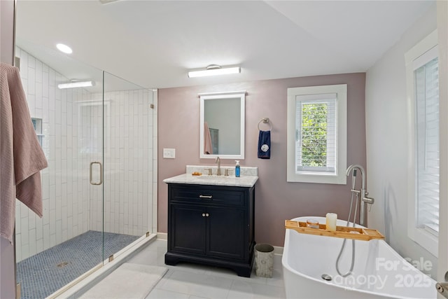 111 Altamahaw Ave, Black Mountain, NC 28711 - full bath with vanity, a freestanding tub, a stall shower, and tile patterned flooring