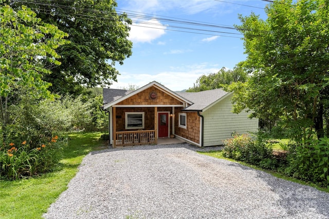 111 Altamahaw Ave, Black Mountain, NC 28711 - view of front facade featuring a porch, roof with shingles, and gravel driveway