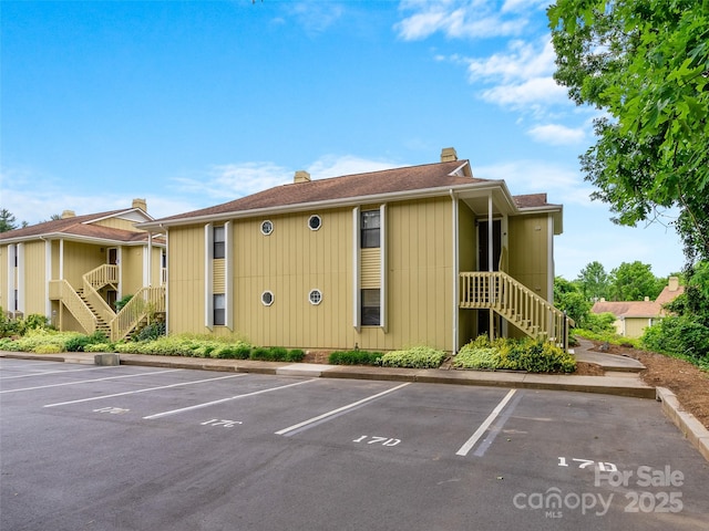 110 Heywood Rd Unit 17C, Arden, NC 28704 - view of property with stairs and uncovered parking