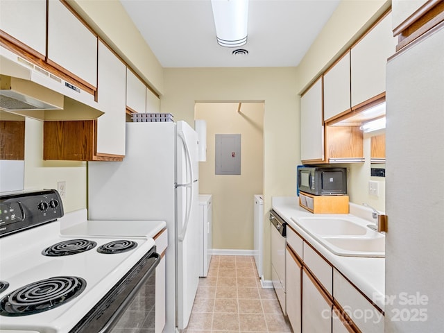 110 Heywood Rd Unit 17C, Arden, NC 28704 - kitchen with range with electric stovetop, electric panel, black microwave, under cabinet range hood, and a sink