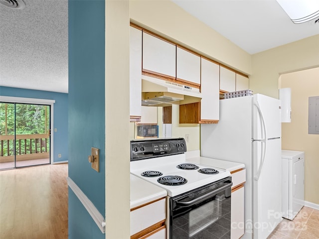 110 Heywood Rd Unit 17C, Arden, NC 28704 - kitchen with range with electric stovetop, under cabinet range hood, washer / dryer, and light countertops