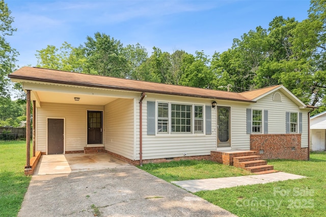 798 Wilson St, China Grove, NC 28023 - single story home featuring crawl space, a front yard, asphalt driveway, and an attached carport