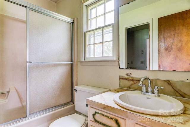 798 Wilson St, China Grove, NC 28023 - bathroom featuring toilet, vanity, and shower / bath combination with glass door