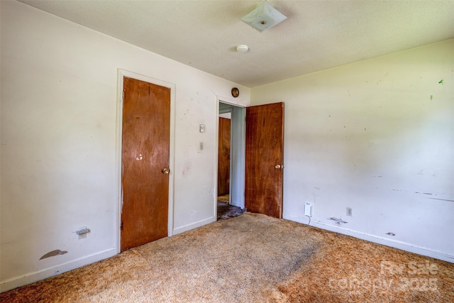 798 Wilson St, China Grove, NC 28023 - empty room featuring carpet floors, baseboards, and a smoke detector