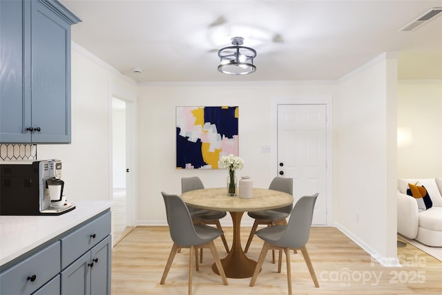 2280 Cannon Farm Rd, China Grove, NC 28023 - dining room featuring light wood-style floors, baseboards, and ornamental molding