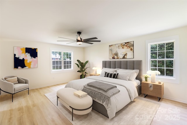 2280 Cannon Farm Rd, China Grove, NC 28023 - bedroom featuring light wood-type flooring, a ceiling fan, and baseboards
