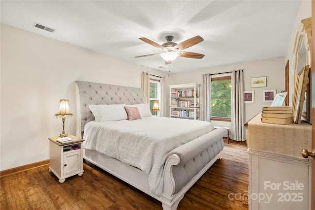 4848 Spicewood Dr, Charlotte, NC 28227 - bedroom with dark wood-style flooring, baseboards, and a ceiling fan