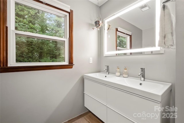4848 Spicewood Dr, Charlotte, NC 28227 - bathroom featuring double vanity and baseboards