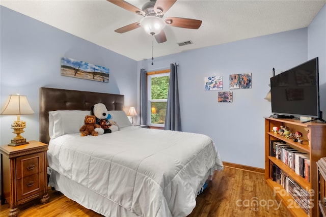 4848 Spicewood Dr, Charlotte, NC 28227 - bedroom featuring light wood-style flooring, baseboards, and ceiling fan