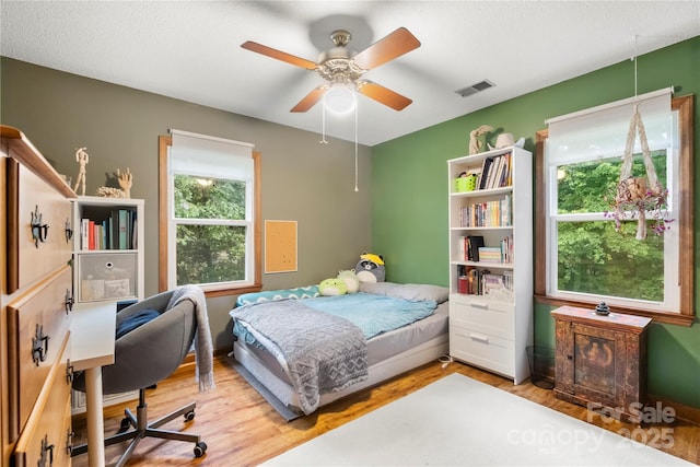 4848 Spicewood Dr, Charlotte, NC 28227 - bedroom with wood finished floors, an office area, and a ceiling fan