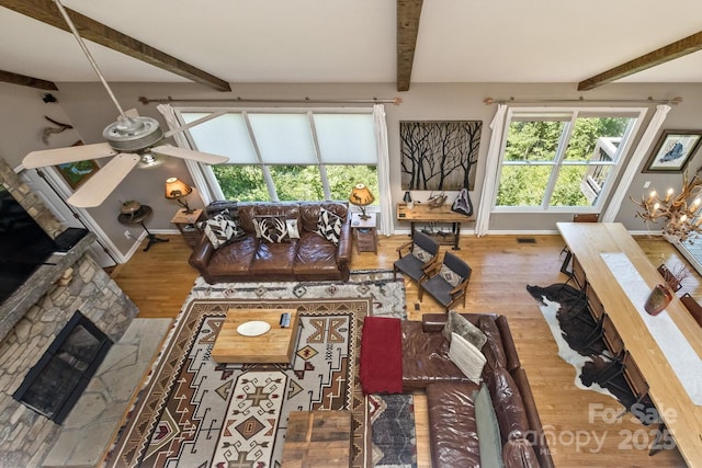 28 Mountain Vista Dr Unit 1 & 2, Asheville, NC 28804 - living area featuring wood finished floors, beam ceiling, a fireplace, baseboards, and plenty of natural light