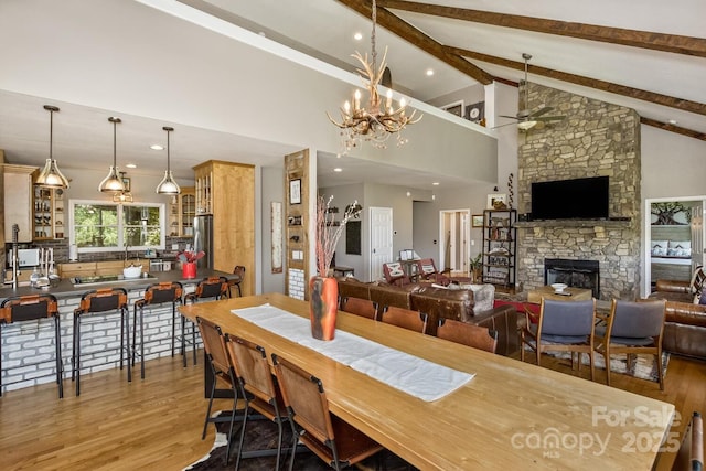 28 Mountain Vista Dr Unit 1 & 2, Asheville, NC 28804 - dining area featuring ceiling fan, wood finished floors, a stone fireplace, a chandelier, and recessed lighting