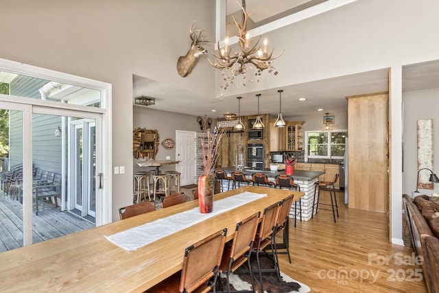 28 Mountain Vista Dr Unit 1 & 2, Asheville, NC 28804 - dining room featuring light wood-style floors, a chandelier, a towering ceiling, and recessed lighting