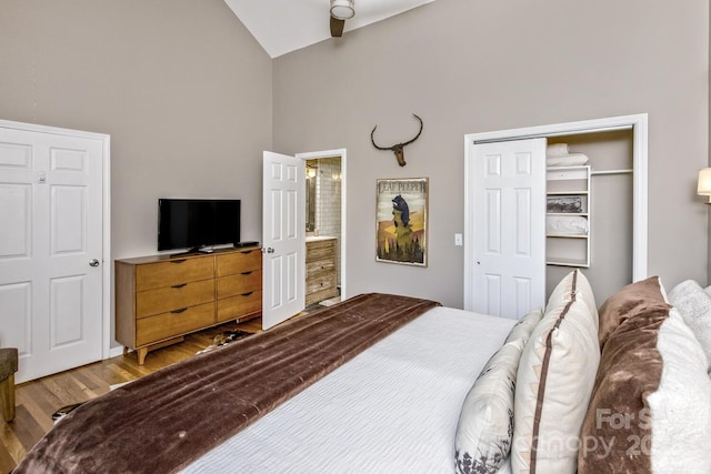 28 Mountain Vista Dr Unit 1 & 2, Asheville, NC 28804 - bedroom with high vaulted ceiling, wood finished floors, a closet, and ensuite bathroom