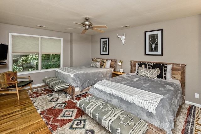 28 Mountain Vista Dr Unit 1 & 2, Asheville, NC 28804 - bedroom featuring baseboards, wood finished floors, and ceiling fan
