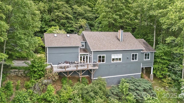 28 Mountain Vista Dr Unit 1 & 2, Asheville, NC 28804 - back of house featuring a shingled roof, a chimney, a deck, and a wooded view