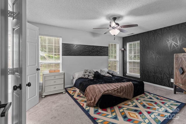 8906 Pickering Grove Ln, Charlotte, NC 28216 - carpeted bedroom featuring a textured ceiling and a ceiling fan
