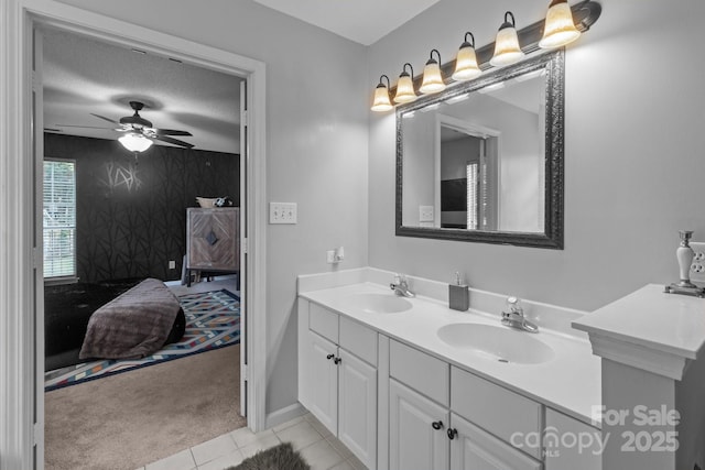 8906 Pickering Grove Ln, Charlotte, NC 28216 - full bathroom with double vanity, a ceiling fan, tile patterned flooring, an accent wall, and ensuite bathroom