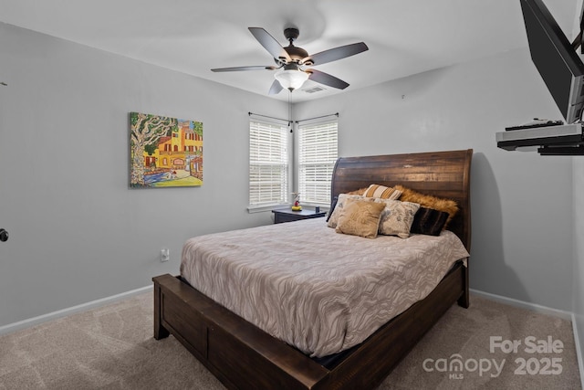 8906 Pickering Grove Ln, Charlotte, NC 28216 - carpeted bedroom with baseboards and a ceiling fan