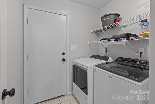 8906 Pickering Grove Ln, Charlotte, NC 28216 - laundry area with washer and clothes dryer and light tile patterned floors