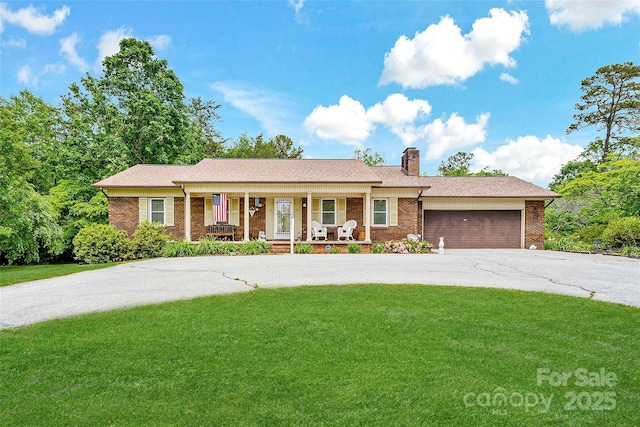 7050 W US-70 Hwy, Old Fort, NC 28762 - ranch-style house featuring a porch, concrete driveway, brick siding, and a front lawn