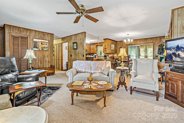 7050 W US-70 Hwy, Old Fort, NC 28762 - living room featuring wooden walls, ceiling fan, a chandelier, carpet, and a textured ceiling