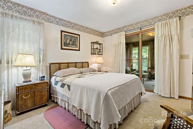 7050 W US-70 Hwy, Old Fort, NC 28762 - bedroom featuring light colored carpet and access to outside