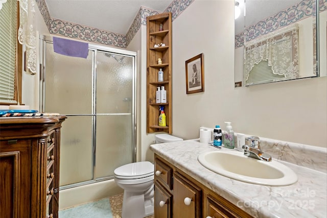 7050 W US-70 Hwy, Old Fort, NC 28762 - full bath featuring vanity, a stall shower, toilet, and a textured ceiling