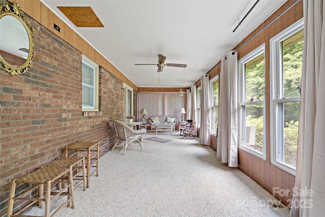 7050 W US-70 Hwy, Old Fort, NC 28762 - sunroom / solarium with carpet floors, brick wall, and wood walls