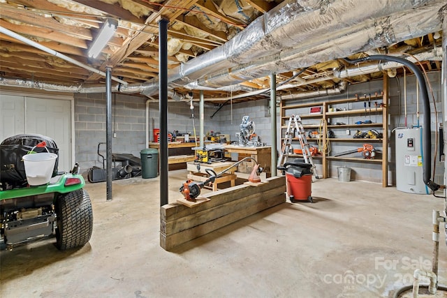 7050 W US-70 Hwy, Old Fort, NC 28762 - unfinished basement with water heater, concrete block wall, and a workshop area