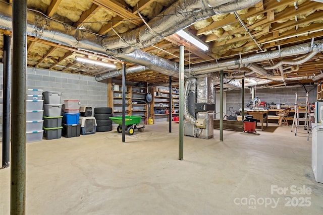 7050 W US-70 Hwy, Old Fort, NC 28762 - unfinished basement with concrete block wall and heating unit