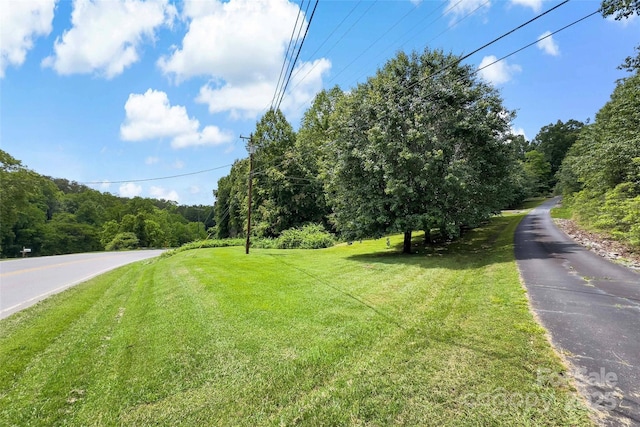 7050 W US-70 Hwy, Old Fort, NC 28762 - view of asphalt road featuring a wooded view