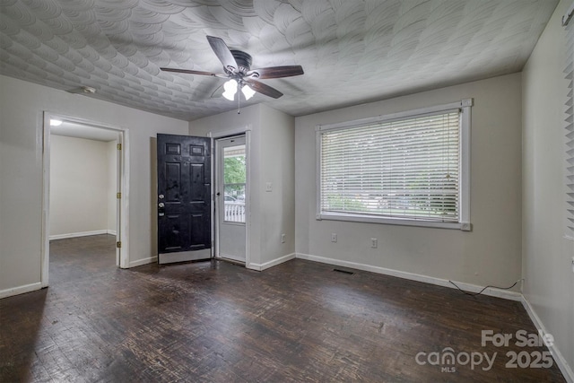 1036 20th St NE, Hickory, NC 28601 - entryway featuring dark wood-style flooring, ceiling fan, and baseboards