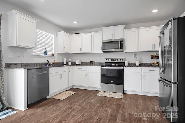 2013 Eastway Dr, Dallas, NC 28034 - kitchen with stainless steel appliances, white cabinetry, dark wood-type flooring, dark stone counters, and recessed lighting