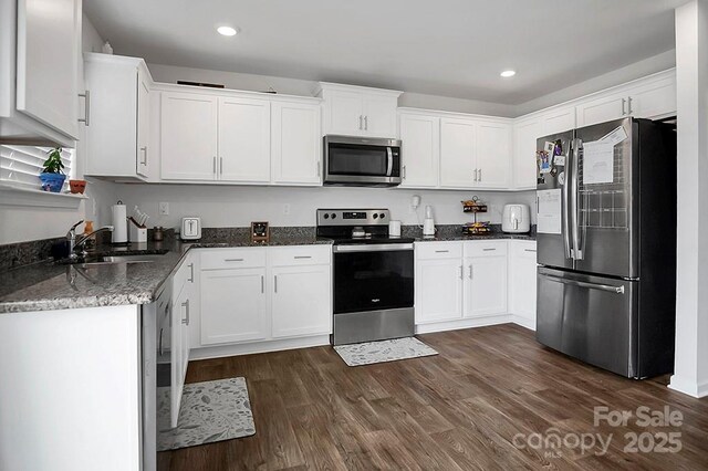 2013 Eastway Dr, Dallas, NC 28034 - kitchen with stainless steel appliances, a sink, white cabinets, dark wood-type flooring, and recessed lighting